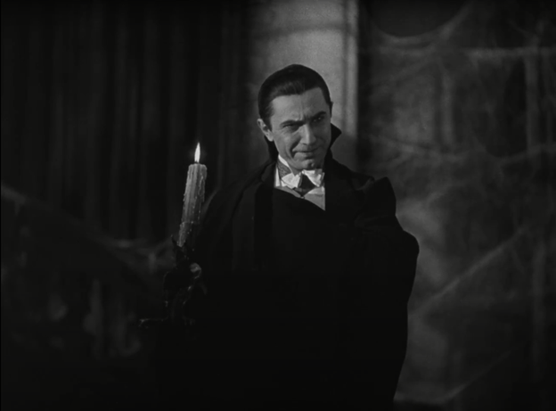 Caption: Bela Lugosi as Dracula in Tod Browning’s 1931 film Dracula. In this scene, Dracula speaks fondly of wolves and similar beasts as “children of the night” making music, creating even more of a bond between vampires and darkness, the night, and the moon in a way similar to Joseph Sheridan Le Fanu’s Carmilla.